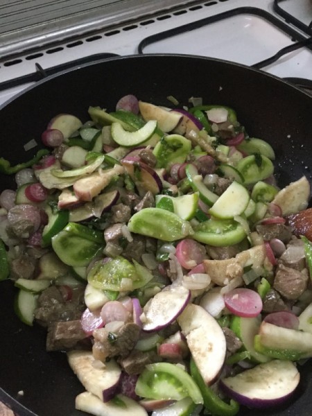 adding eggplant to dish