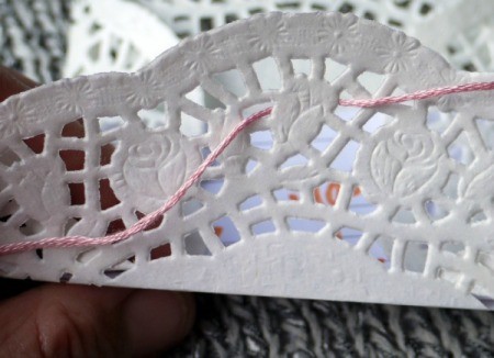 Paper Doily Envelope - cut a length of floss long enough to tie a bow and thread through the bottom flap holes