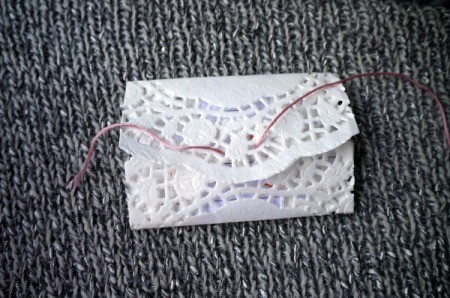 Paper Doily Envelope - thread floss through holes on flap