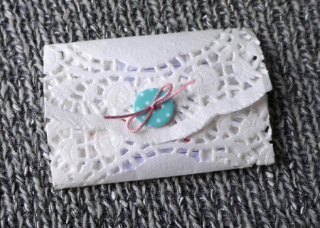 Paper Doily Envelope - tie a bow and trim ends of floss