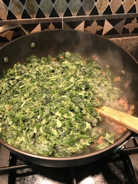 kale and spinach added to pan