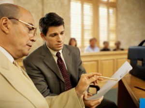 Two lawyers looking at a legal document.