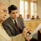 Two lawyers looking at a legal document.