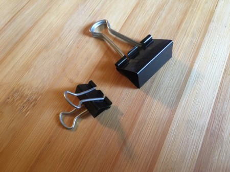 Two different sized binder clips, to be used in the freezer.