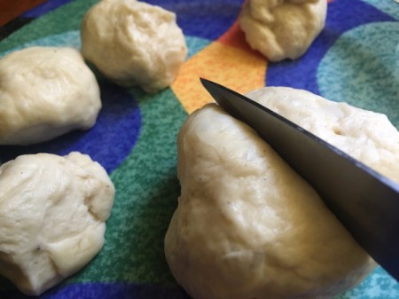 cutting dough into small pieces