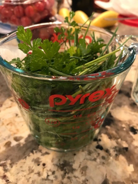 messing cup full of herbs