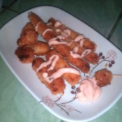 fried Cheese Pops and Sticks with sauce on plate