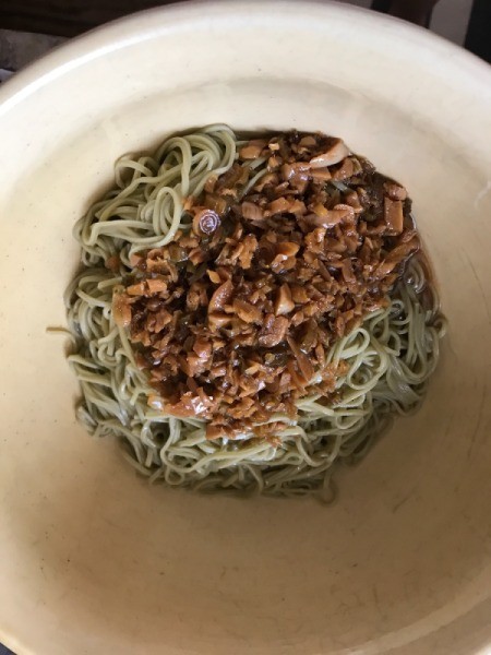 sauce added to noodles