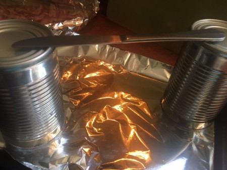 tin cans with knife bridge