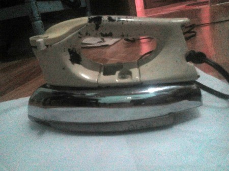 Coin Purse Made from Hot Glue Sticks - place iron on top of glue sticks and move slowly to melt but not crumple paper