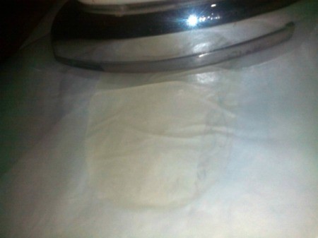 Coin Purse Made from Hot Glue Sticks - melted glue under layer of parchment paper