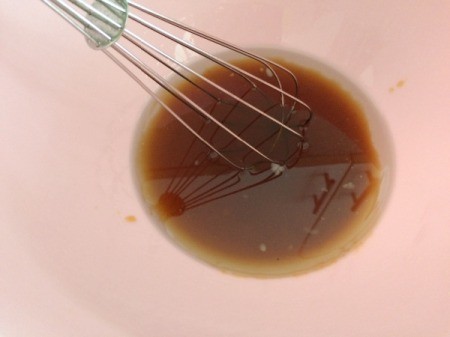 mixing oil and honey in bowl