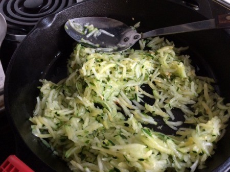 Shredded Zucchini added to pan
