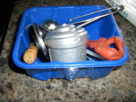 A blue packaging container for mushrooms, used to organize a drawer.