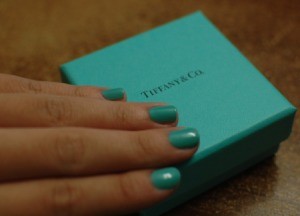Nails painted in Tiffany blue on a Tiffany jewelry box.