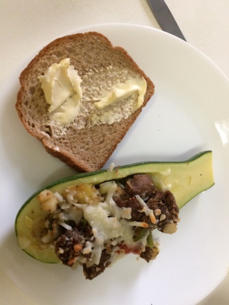 Stuffed Zucchini Squash on plate with buttered bread