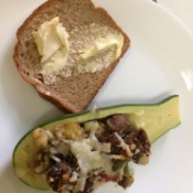 Stuffed Zucchini Squash on plate with buttered bread