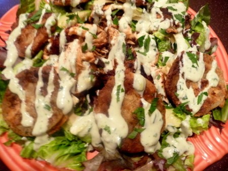 Blackened Salmon and Fried Green Tomato Salad on plate