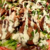 Blackened Salmon and Fried Green Tomato Salad on plate