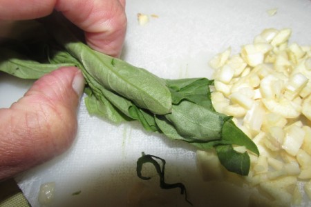 rolled basil leaves and garlic