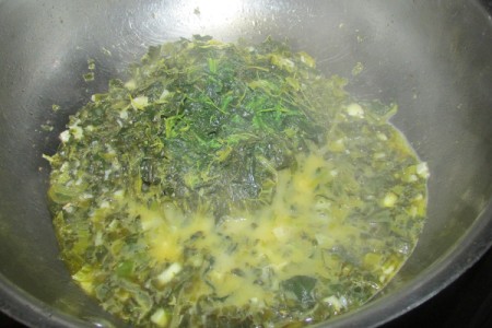 spinach and herbs in pan