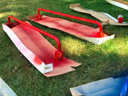 Refinishing a Wooden Playground - red handrails