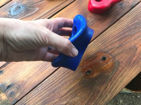 Refinishing a Wooden Playground - blue plastic climbing wall part