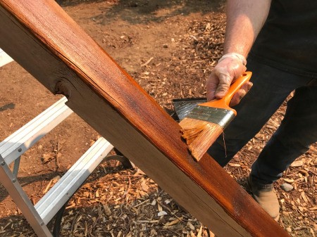 Refinishing a Wooden Playground - staining wooden parts