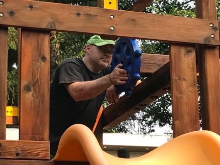 Refinishing a Wooden Playground - reattaching steering wheel