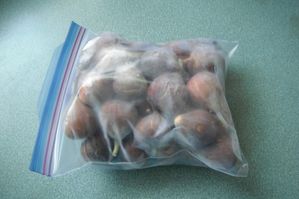 A ziptop bag full of frozen figs.