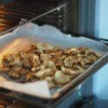 Apple chips being dried in an oven.