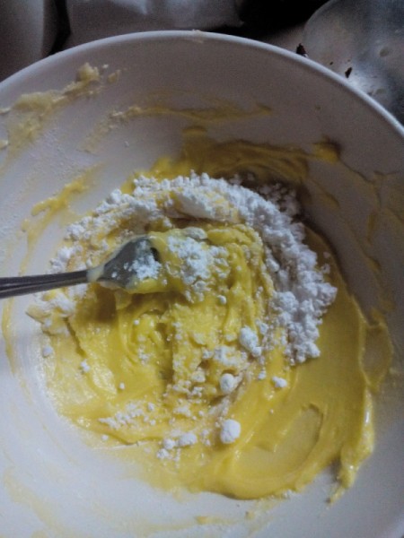 mixing butter and powdered sugar