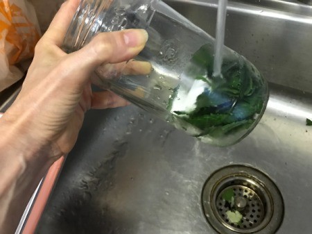 pouring hot water over jar