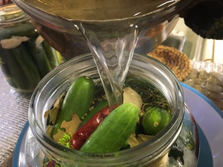 pouring brine into jar