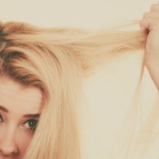 A blonde woman with over processed hair.