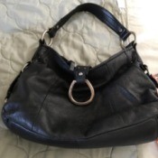 A new leather handbag that is slouchy and empty.