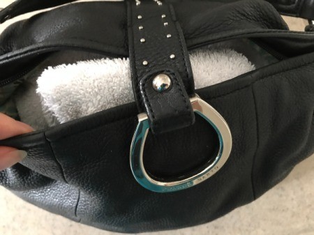 A towel inside a leather handbag to help keep the shape.