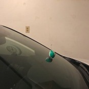 Using a tennis ball to mark how far to park in your garage.