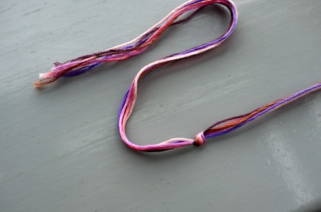 Friendship Bracelet with Simple Sliding Knot - tie a knot several inches from one end