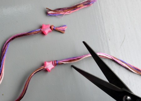 Friendship Bracelet with Simple Sliding Knot - tie big knots to keep beads on and then trim