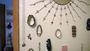 Jewelry being displayed using pushpins.