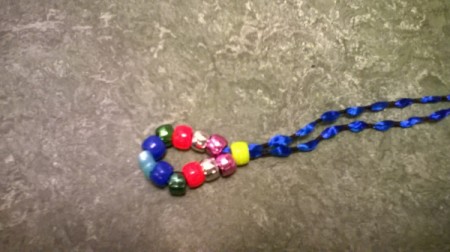 Closeup of single bead pushed up against the center beads.