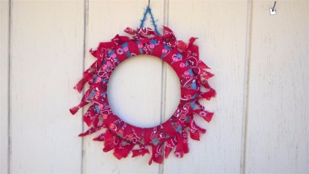 Denim and Bandanna Wreath - finished wreath hanging on an exterior wall