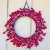 Denim and Bandanna Wreath - finished wreath hanging on an exterior wall