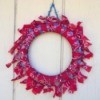 Denim and Bandanna Wreath - finished wreath hanging on an exterior wall