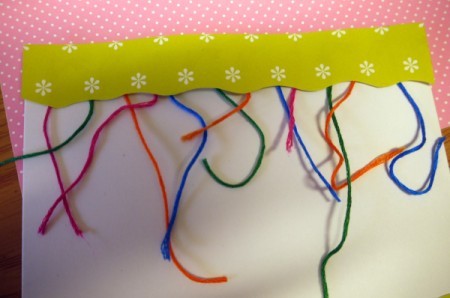 Hanging Baubles Greetings Card - glue the narrower piece of paper to top of card covering ends of floss