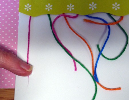 Hanging Baubles Greetings Card - pull each strand of floss taut and glue down
