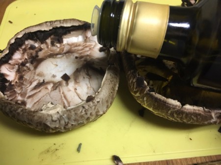 adding olive oil to Portobello Mushroom