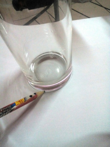 Glittered Glass Coaster Made from Hot Glue - trace the bottom of a glass onto your paper