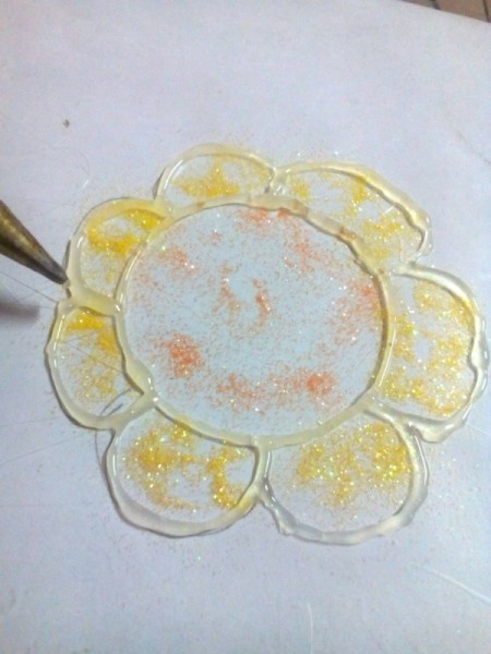 Glittered Glass Coaster Made from Hot Glue - begin tracing around the lines in your drawing using the glue gun